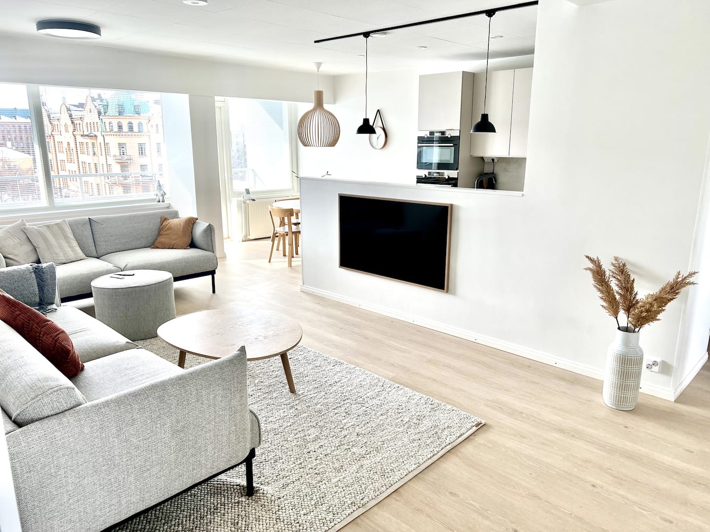 Open living room with city light — Modern Apartment at Vaasa Market Square